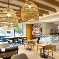 The Coffee Bean & Tea Leaf - Moulmein Rise Shoppes, Malaysia | Products seen: [Turie Rattan Barchair – SH750 - Black, Rafael Rattan 2–Seater Sofa, Warda Lounger & Turie Rattan Chair w Wood Seat Frame]